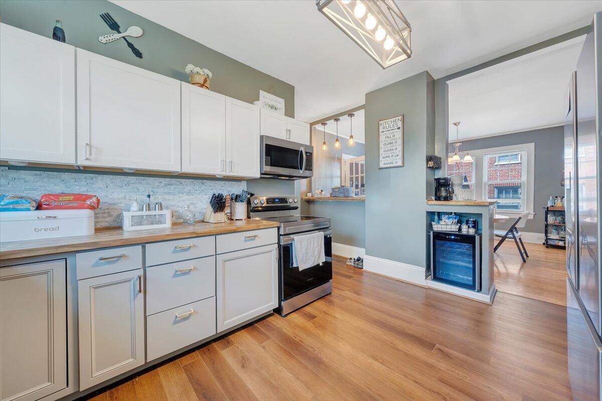 528 Riverland Road Southeast Roanoke, VA 24014 - Photo 10 of 42 a kitchen with cabinets and wooden floor