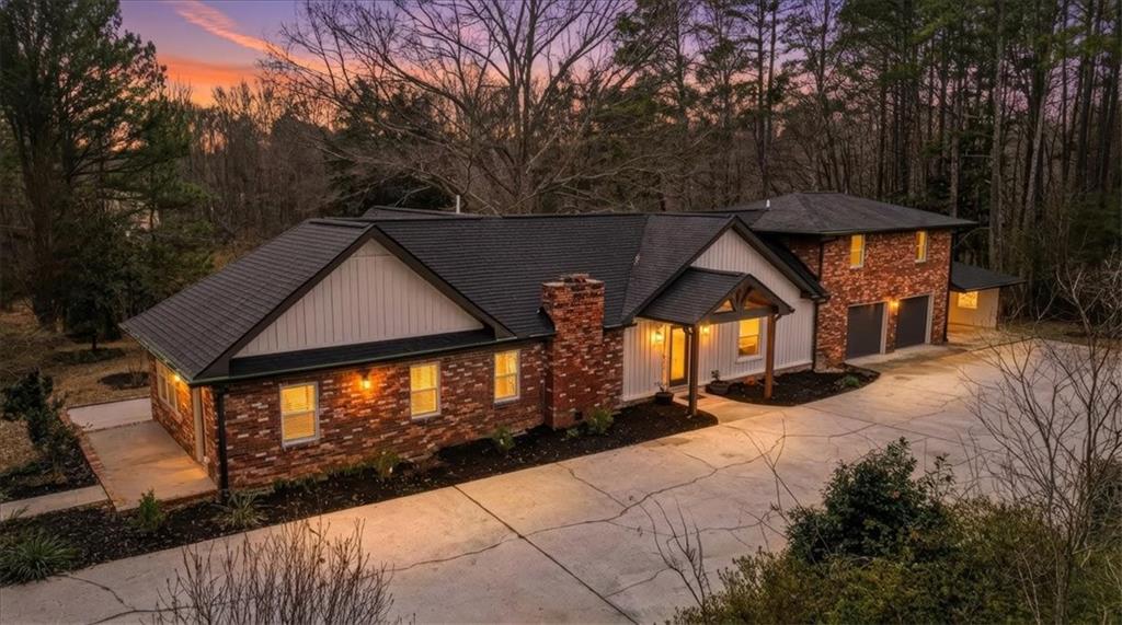 4911 Lower Jersey Road Oxford, GA 30054 - Photo 1 of 56 a view of house with yard and sitting area