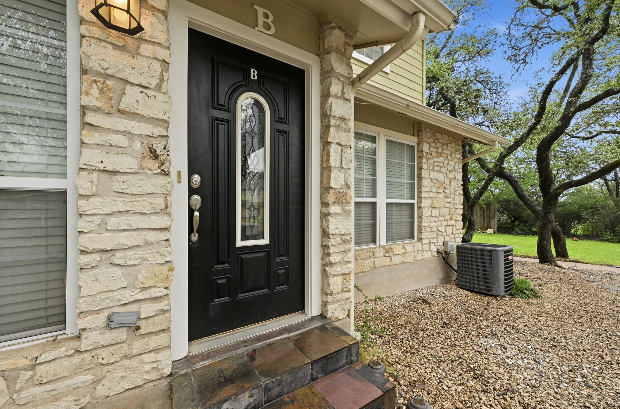 1504 Allen Road, Unit B Austin, TX 78746 - Photo 2 of 22 Entry door with 2 assigned parking space right in front of it.