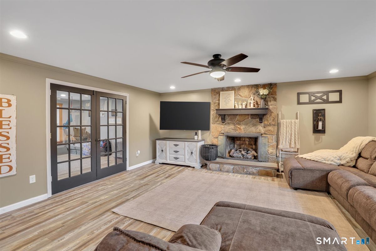 122 Antrim Road Coventry, CT 06238 - Photo 13 of 40 Living room with stone fireplace