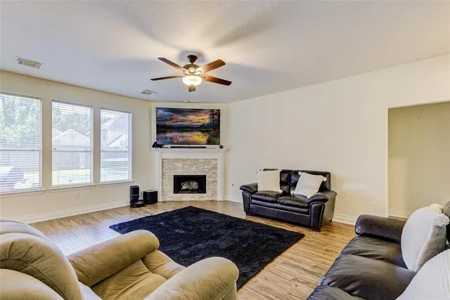 a living room with furniture or couch and a fireplace