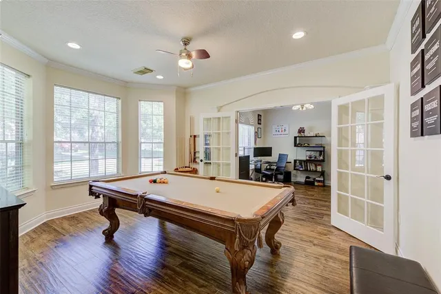 a room with dining table and wooden floor