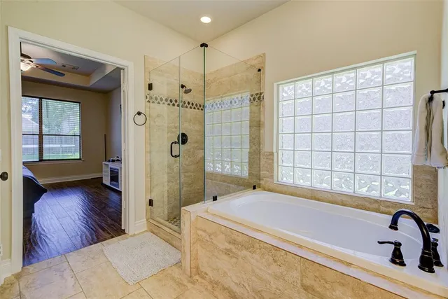 a bathroom with a bathtub and a shower