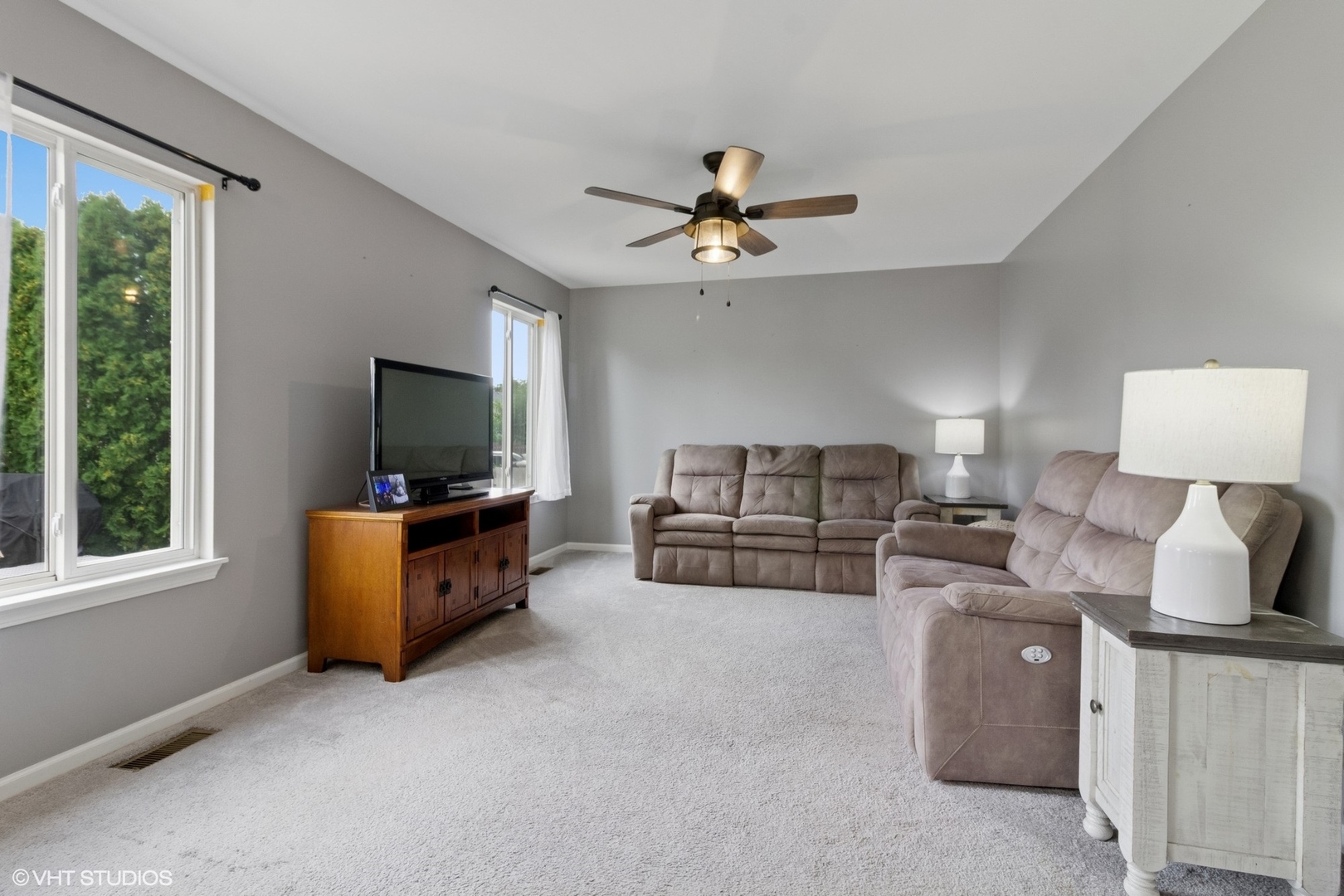 4300 Dobbins Street Plano, IL 60545 - Photo 11 of 31 a living room with furniture and a flat screen tv