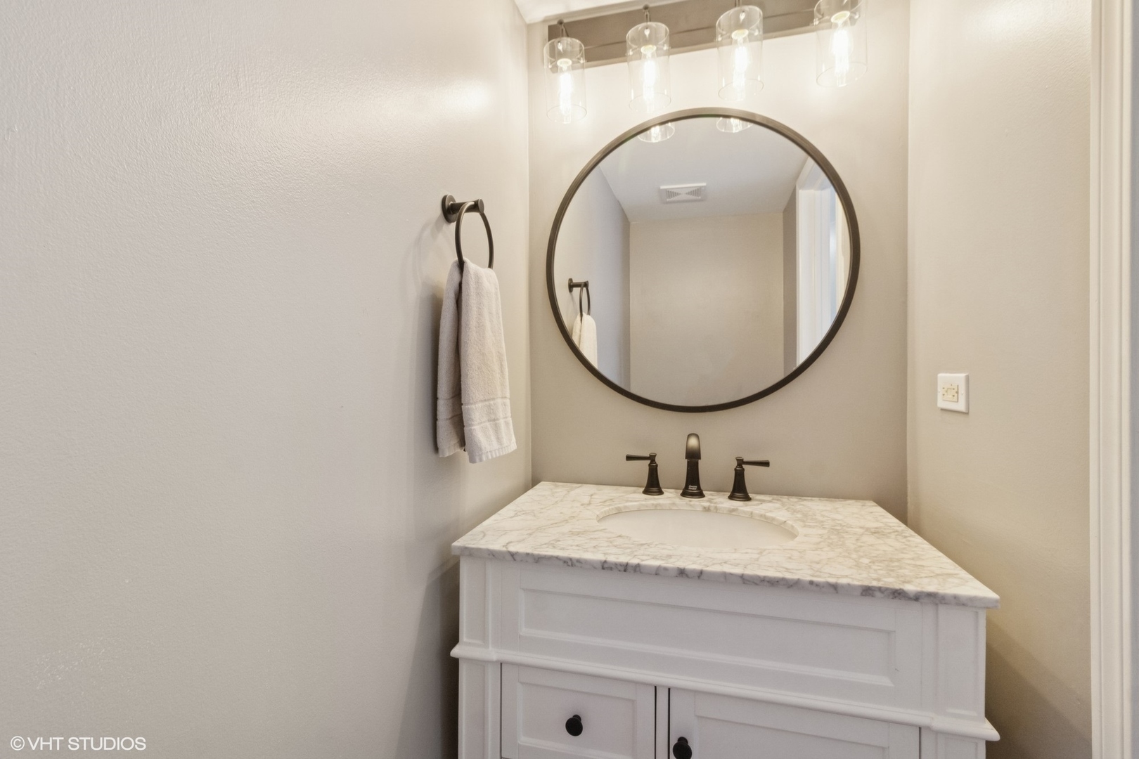 4300 Dobbins Street Plano, IL 60545 - Photo 12 of 31 a bathroom with a granite countertop sink and a mirror