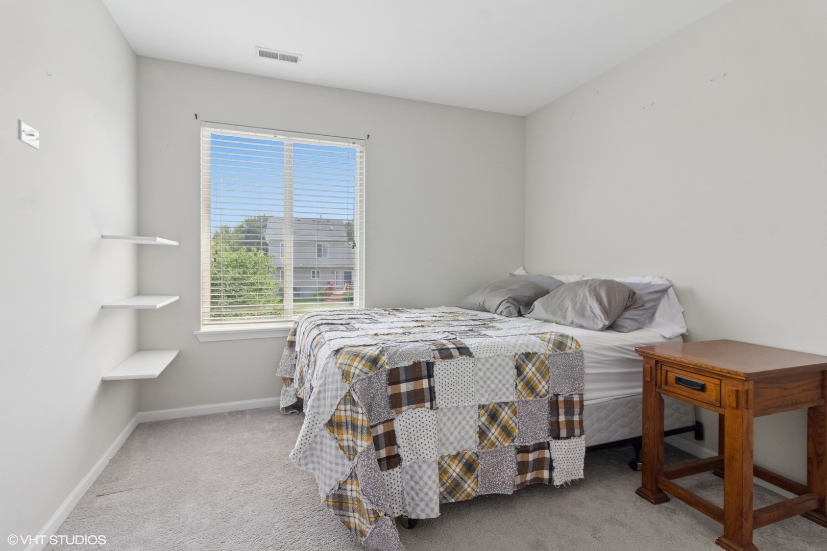 4300 Dobbins Street Plano, IL 60545 - Photo 13 of 31 a bedroom with a bed and a window