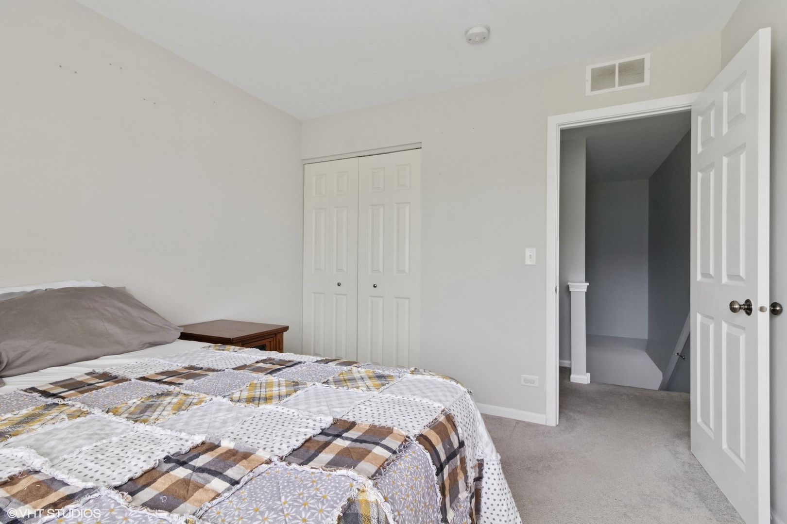4300 Dobbins Street Plano, IL 60545 - Photo 14 of 31 a bedroom with a bed and hallway