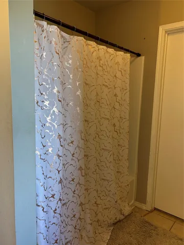 a bathroom with a shower curtain