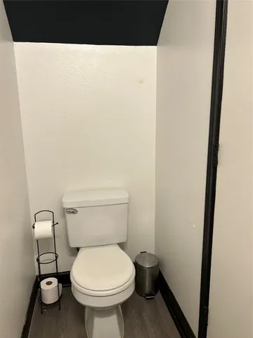 a bathroom with a toilet and a sink