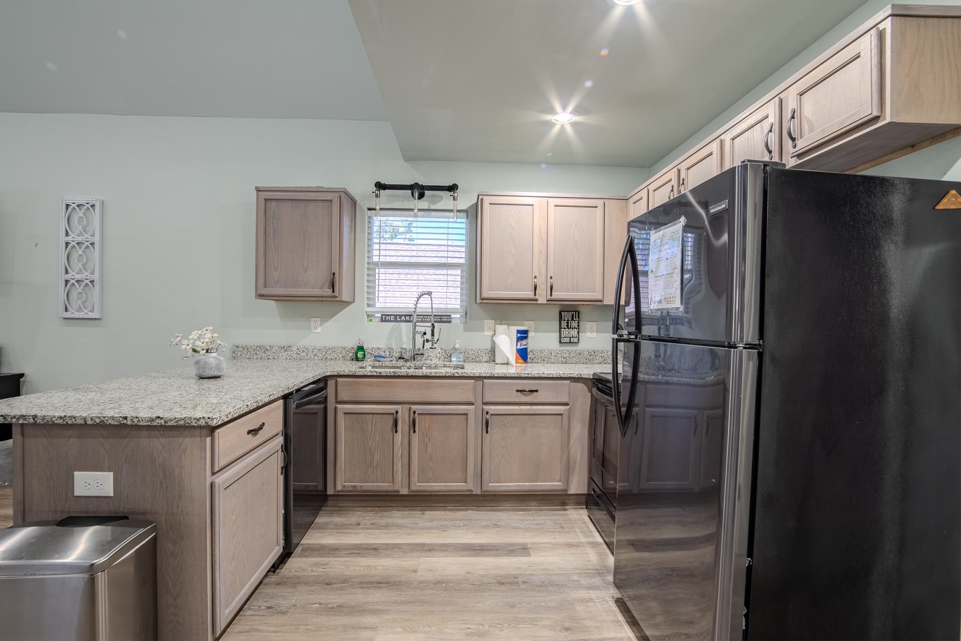 25 Bogey Loop Counce, TN 38326 - Photo 13 of 37 a kitchen with a refrigerator sink and cabinets
