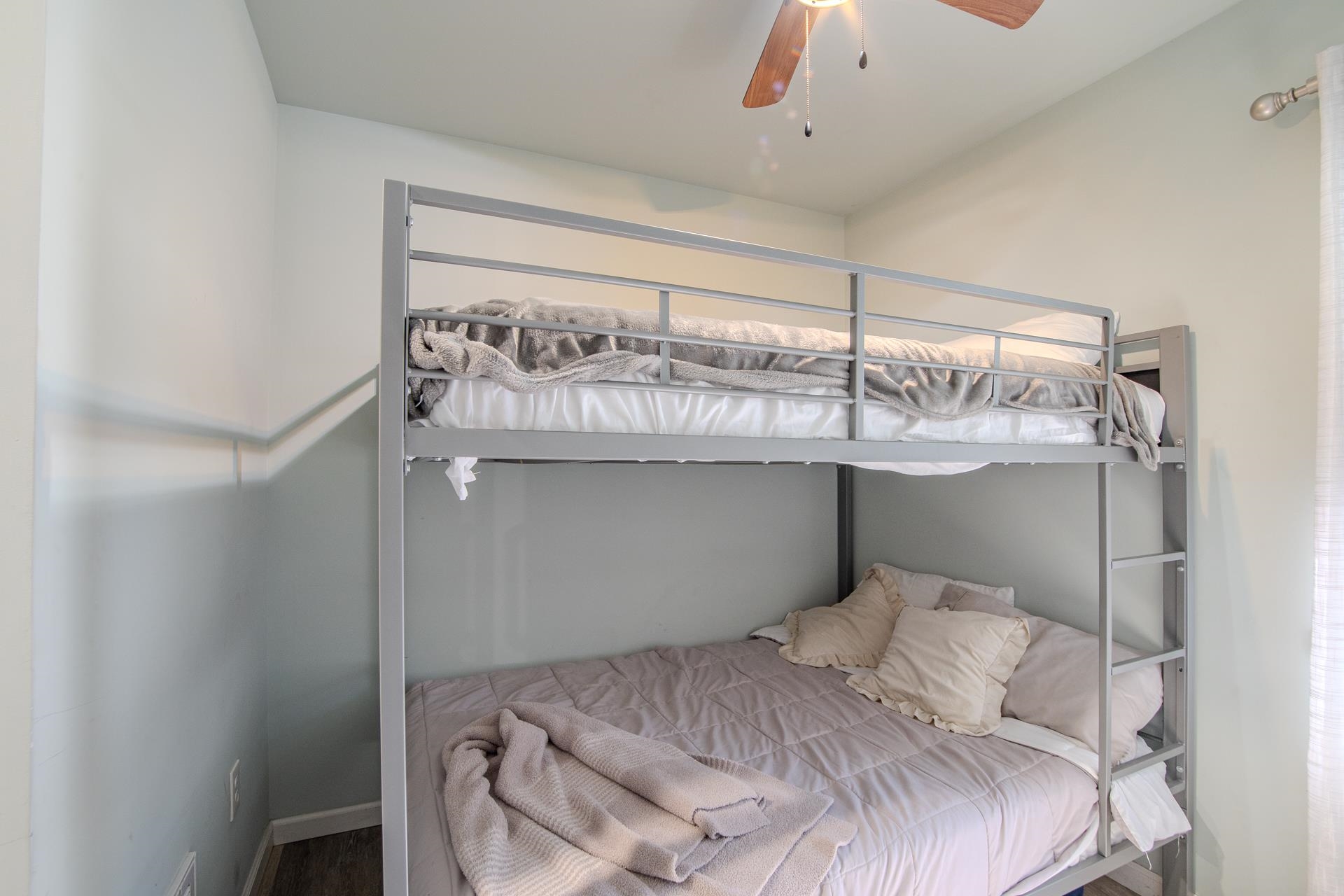 25 Bogey Loop Counce, TN 38326 - Photo 27 of 37 a bedroom with a bed and a chandelier fan