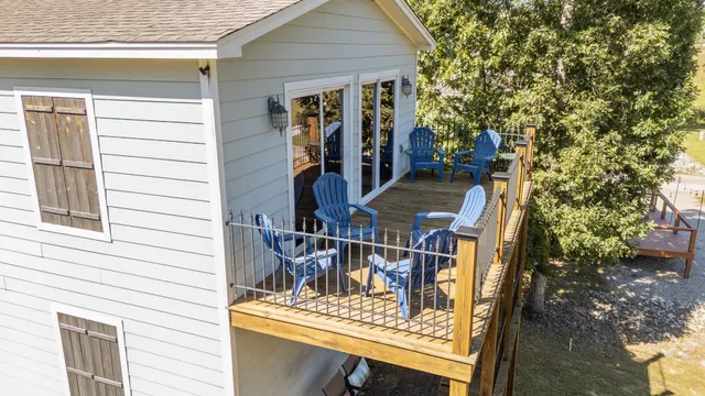 a view of balcony with two chairs and a potted plant