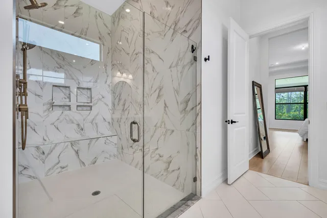 a bathroom with a bathtub and a shower