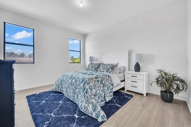 a bedroom with a bed and a dresser