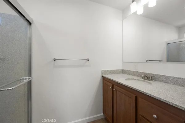 an empty room with windows and entrance