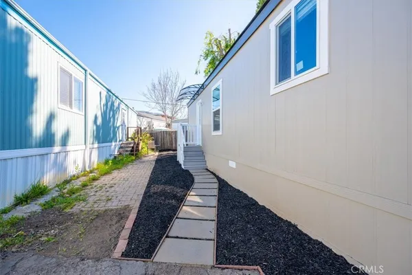 a view of a pathway of a house with a porch