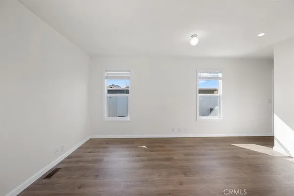 a view of kitchen view wooden floor and window