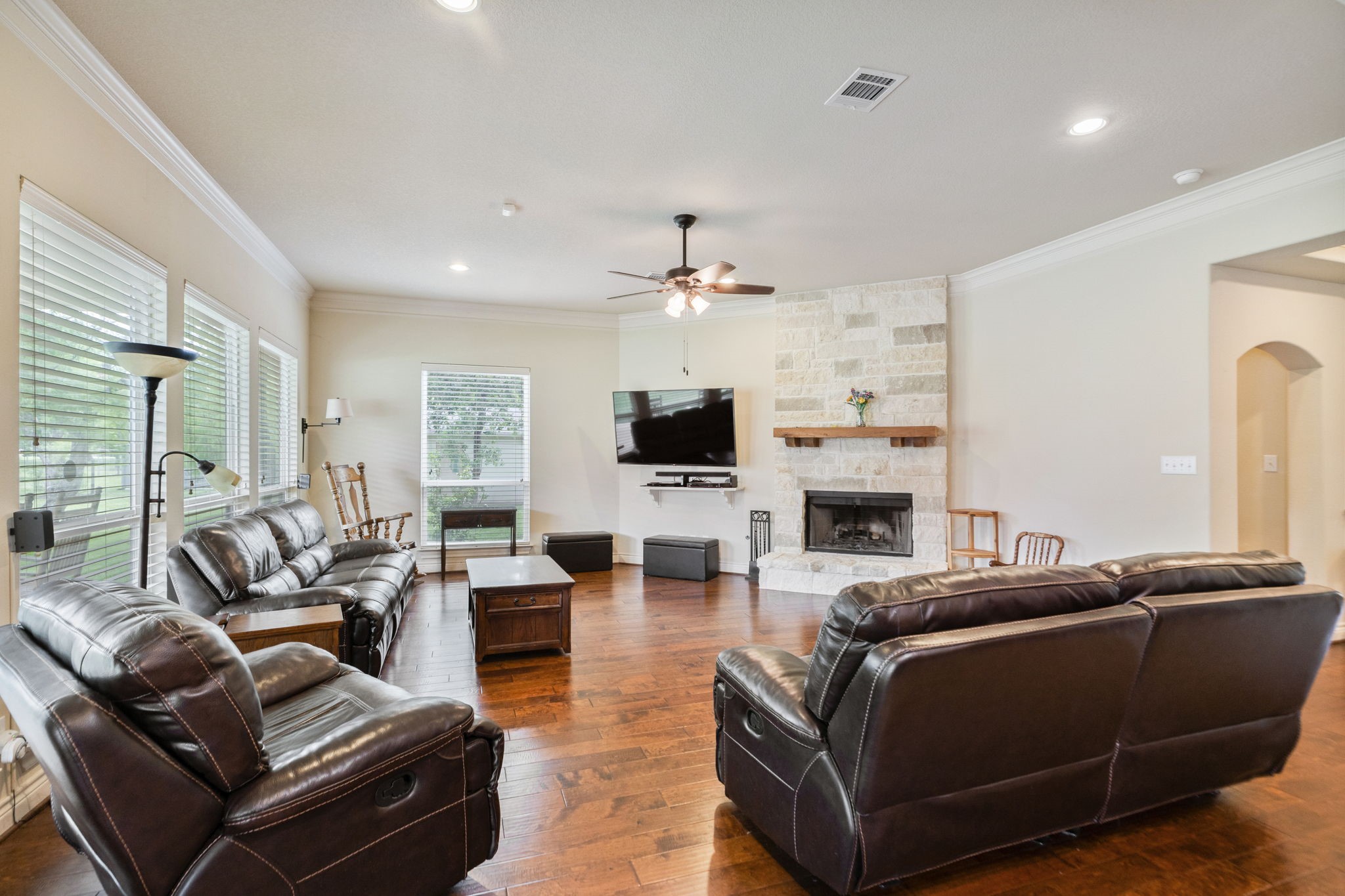 101 Pin Oak Lane Hempstead, TX 77445 - Photo 14 of 50 a living room with furniture a flat screen tv and a fireplace