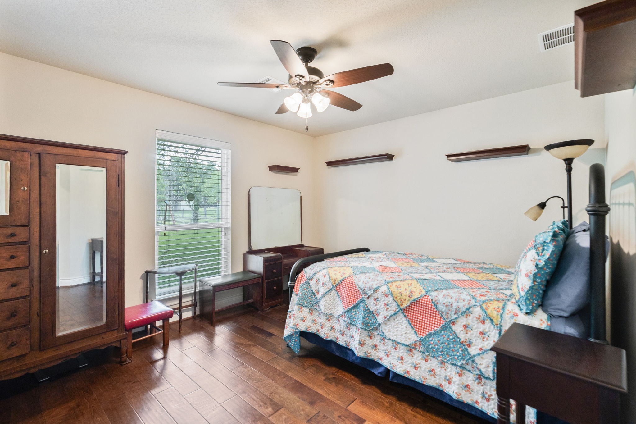 101 Pin Oak Lane Hempstead, TX 77445 - Photo 22 of 50 a bedroom with a bed and wooden floor