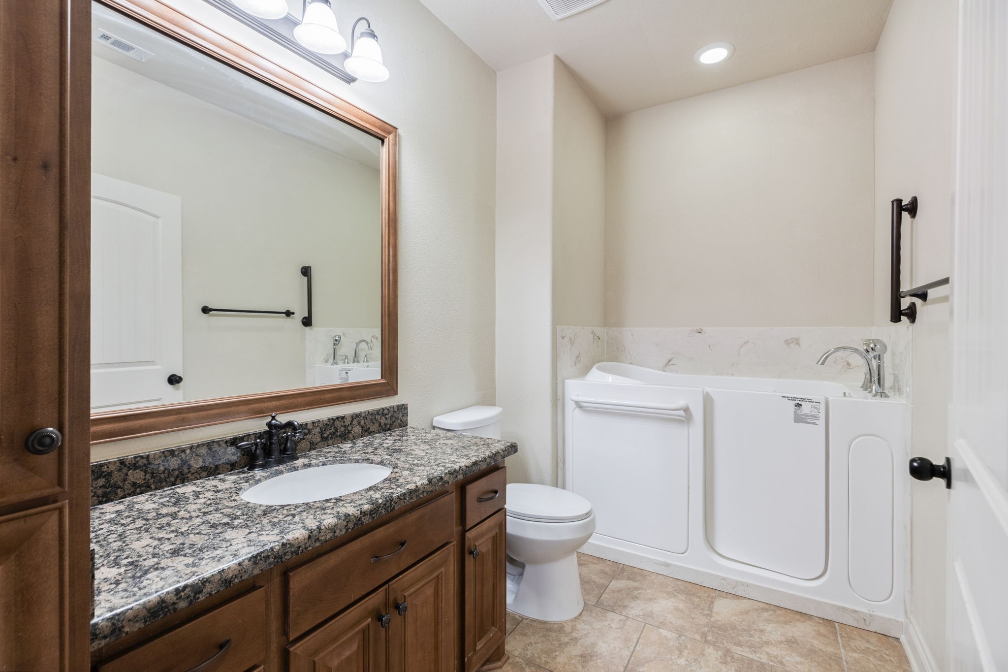 101 Pin Oak Lane Hempstead, TX 77445 - Photo 24 of 50 a bathroom with a granite countertop sink toilet and shower
