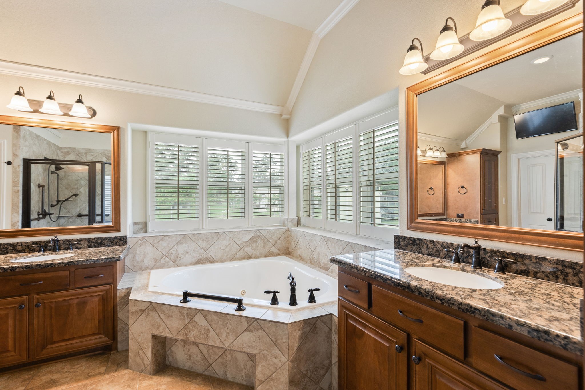 101 Pin Oak Lane Hempstead, TX 77445 - Photo 29 of 50 a bath tub sitting next to a bathroom sink and a window