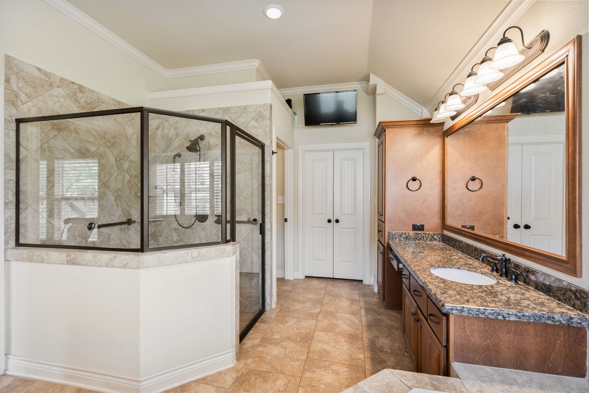 101 Pin Oak Lane Hempstead, TX 77445 - Photo 30 of 50 a bathroom with a granite countertop sink a mirror and shower