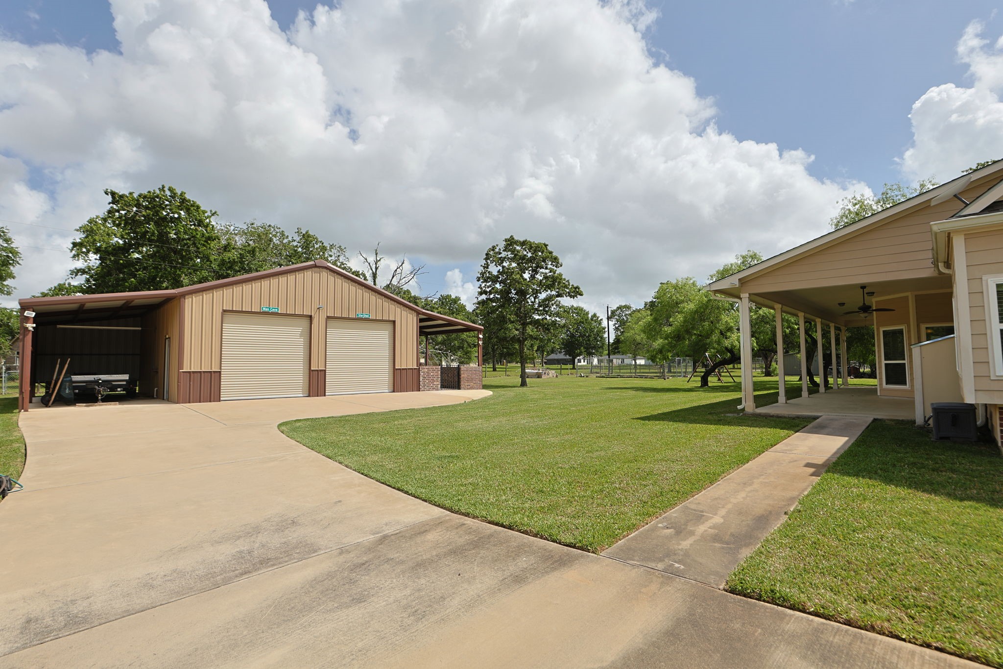 101 Pin Oak Lane Hempstead, TX 77445 - Photo 37 of 50 a front view of a house with a yard and trees