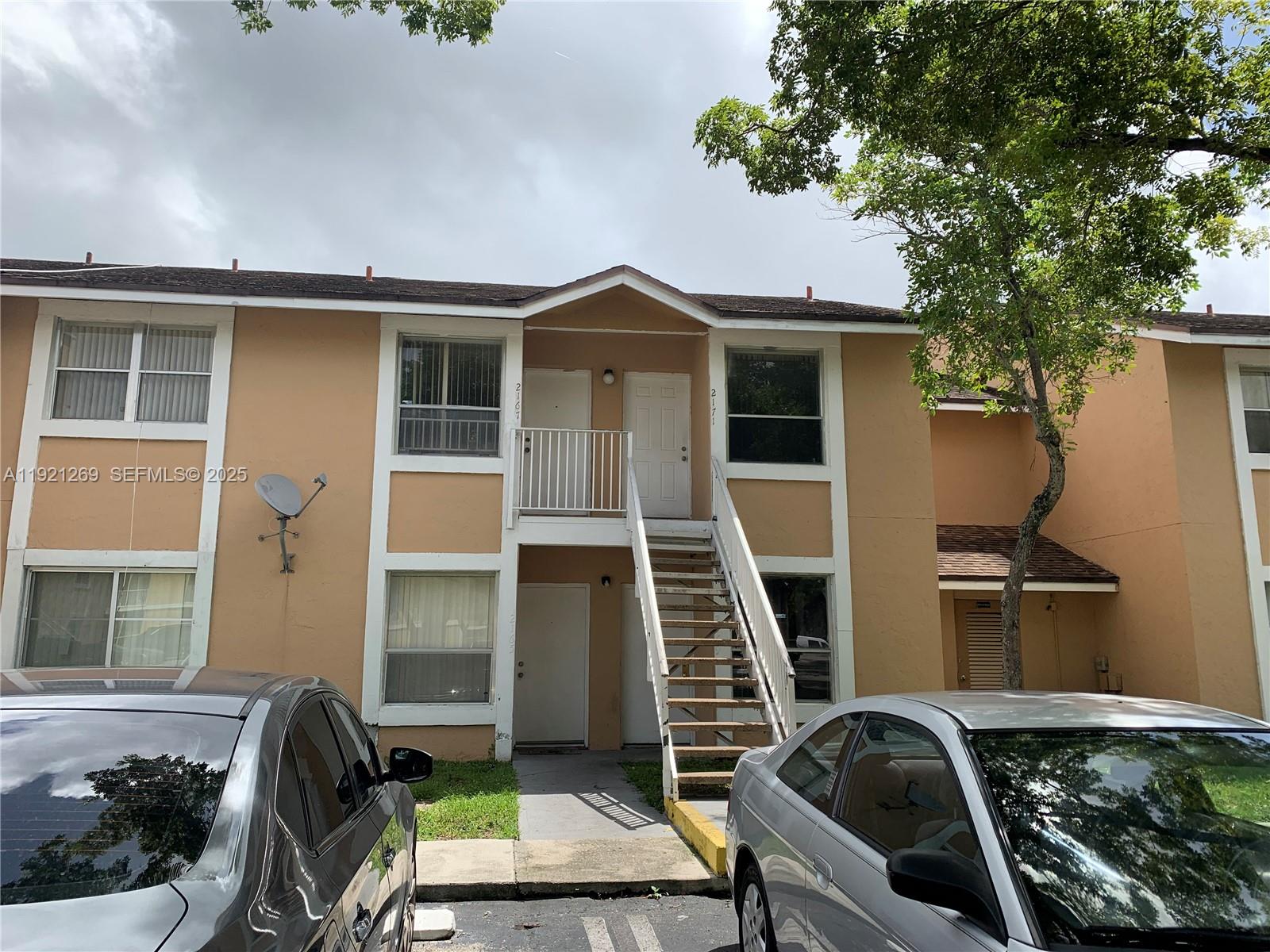2171 Southwest 80th Terrace, Unit 2171 Miramar, FL 33025 - Photo 7 of 7 a backyard of a house with seating space