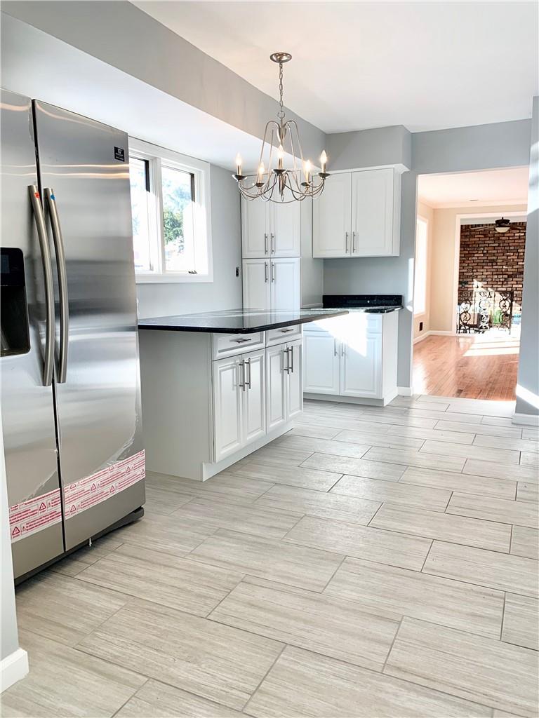 6 Cramer Court Garnerville, NY 10923 - Photo 1 of 1 a kitchen with stainless steel appliances granite countertop a refrigerator and a sink