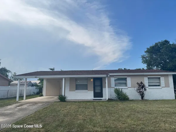 front view of a house with a yard