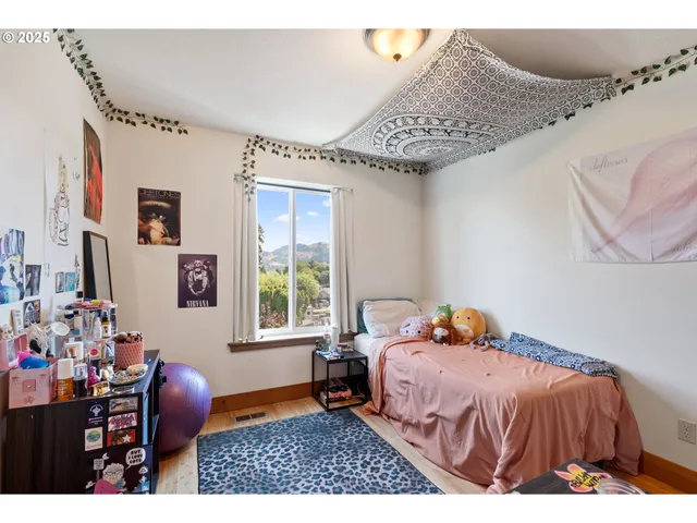 a bedroom with a bed and window