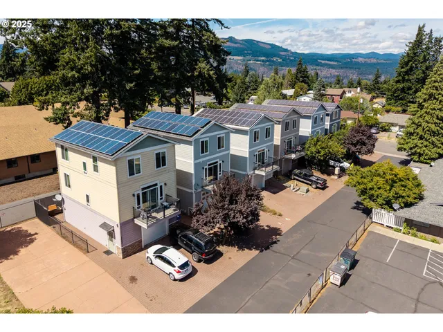 a aerial view of a house with a yard