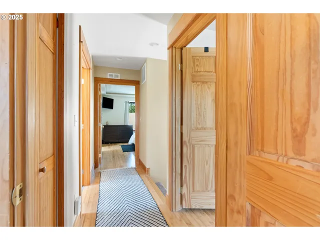 a view of a bathroom from the hallway