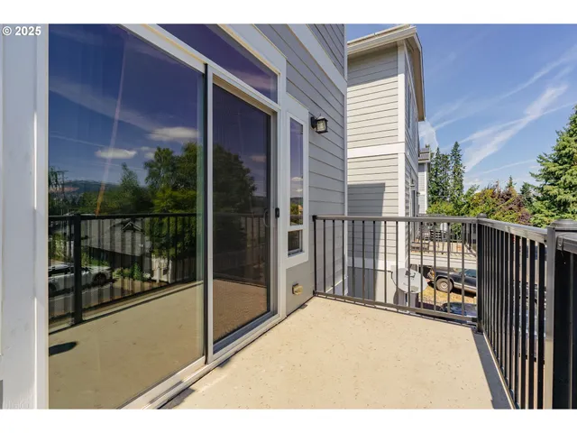 a balcony with a glass door