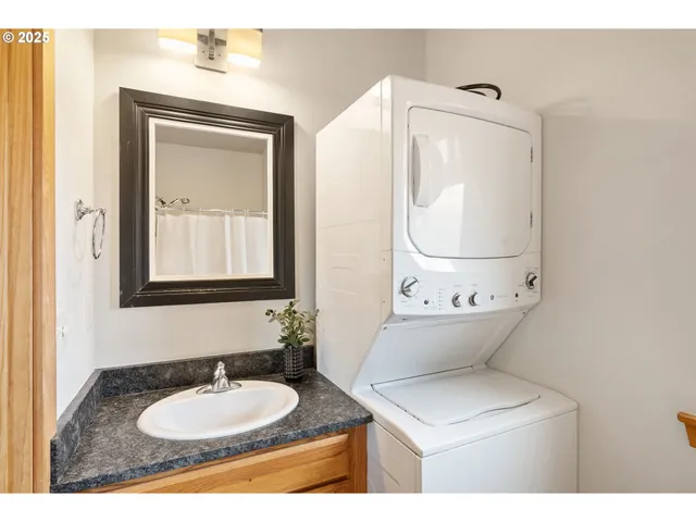 a bathroom with 2 sink mirror and toilet