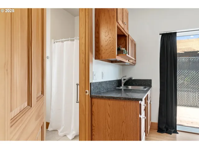a kitchen with stainless steel appliances granite countertop a sink and a cabinets