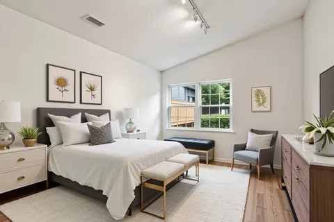 a bedroom with a bed and a couch