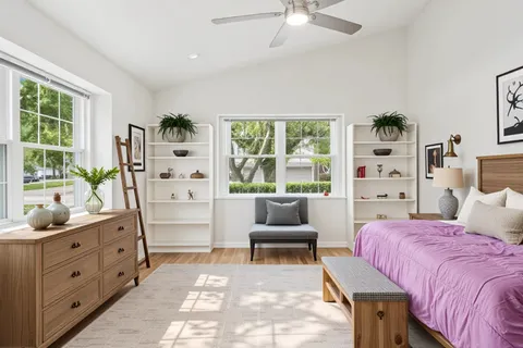 a bedroom with a bed and a couch