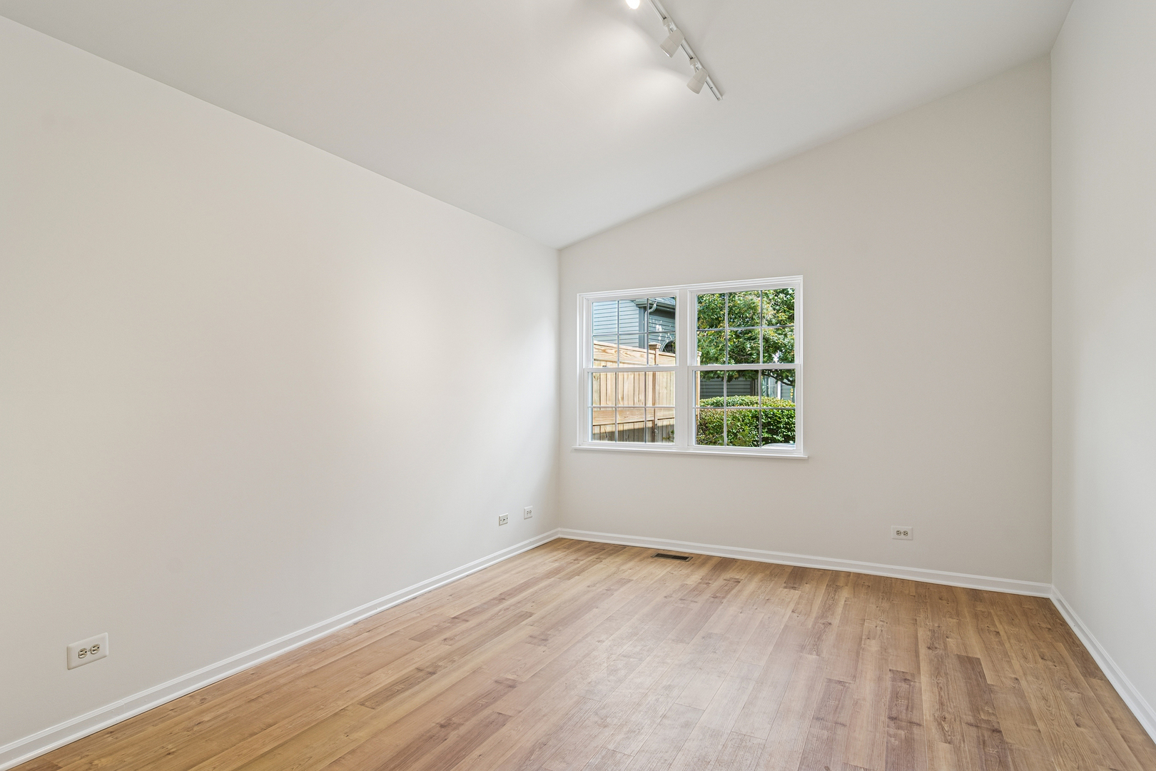381 Bentley Place Buffalo Grove, IL 60089 - Photo 8 of 22 wooden floor in an empty room with a window