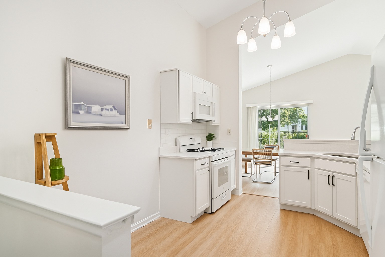 381 Bentley Place Buffalo Grove, IL 60089 - Photo 10 of 22 a kitchen with stainless steel appliances granite countertop a stove a sink dishwasher and a refrigerator with wooden floor