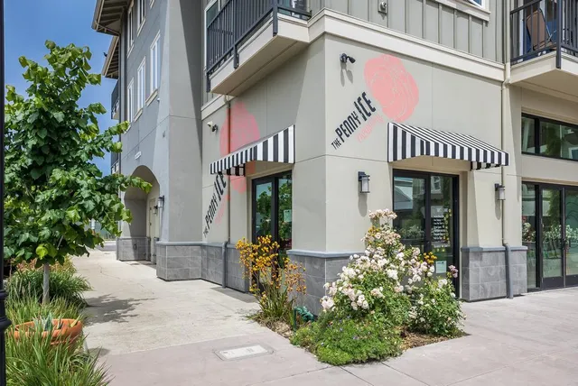 a view of a building with sitting area