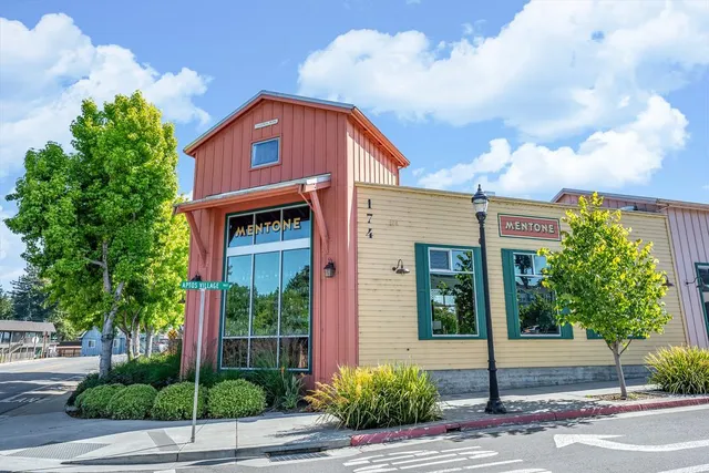 a street sign on a wall next to a building