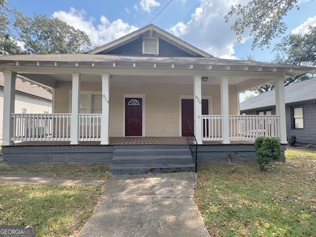 front view of a house with a yard