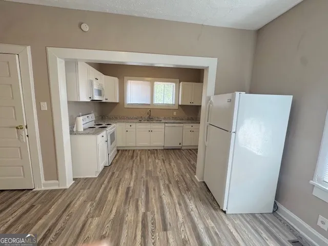 a kitchen with a refrigerator a sink and dishwasher