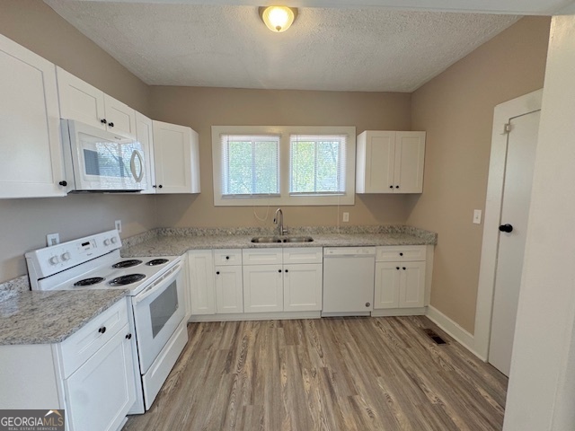 820 Peeples Street Southwest, Unit 820 Atlanta, GA 30310 - Photo 23 of 37 a kitchen with granite countertop white cabinets sink and stainless steel appliances