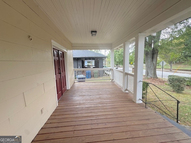 820 Peeples Street Southwest, Unit 820 Atlanta, GA 30310 - Photo 4 of 37 a view of a patio with wooden floor and iron stairs