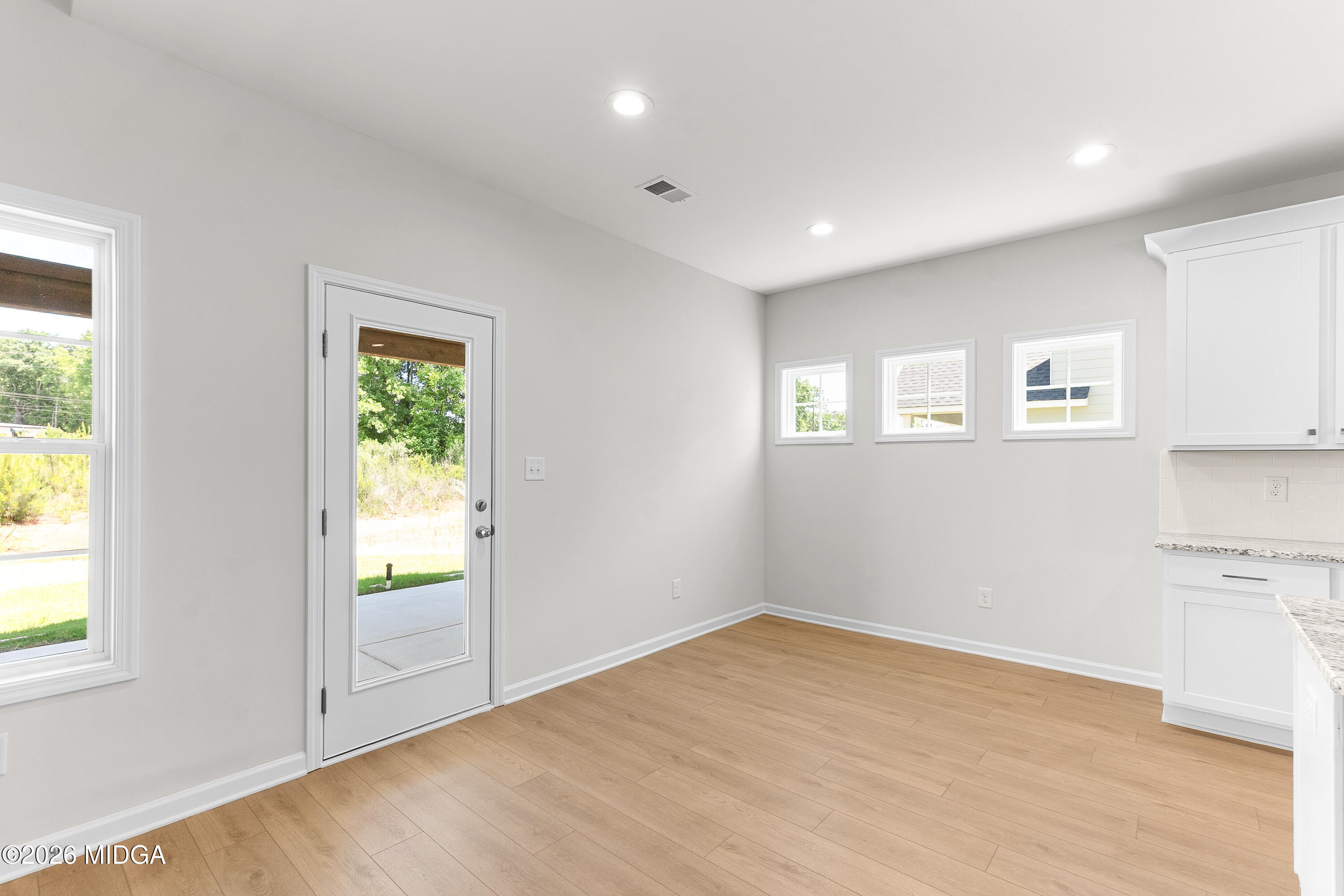 5393 Felles Way, Unit 359 Forsyth, GA 31029 - Photo 13 of 54 a view of empty room with wooden floor and fan