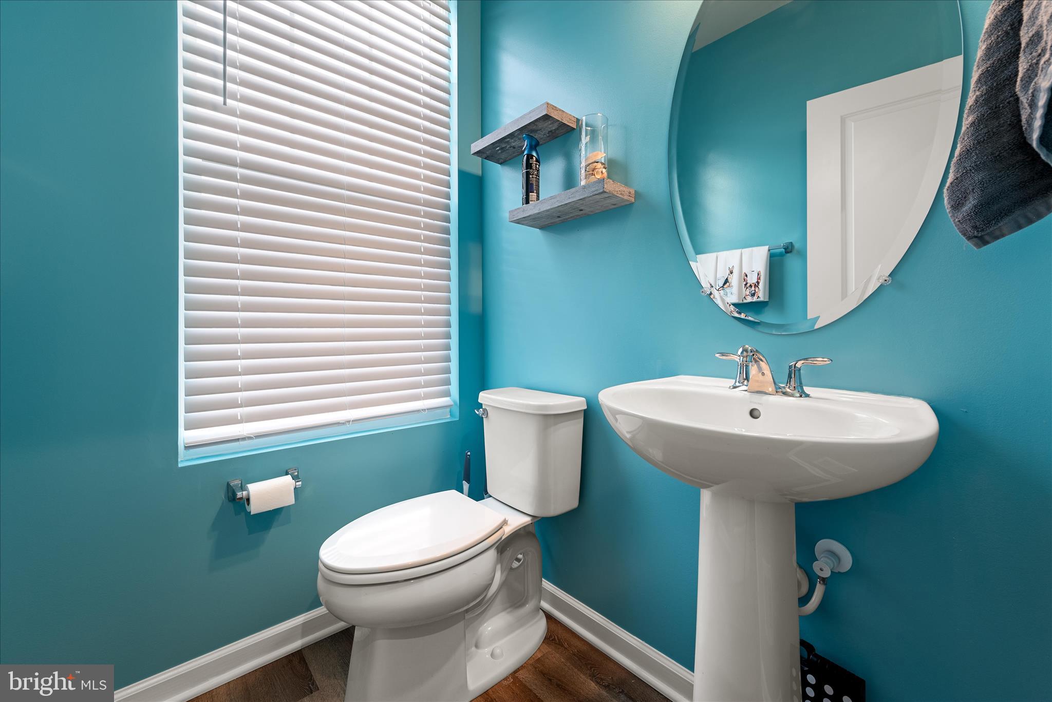 504 National Street Ranson, WV 25438 - Photo 14 of 33 a bathroom with a sink a mirror and a toilet