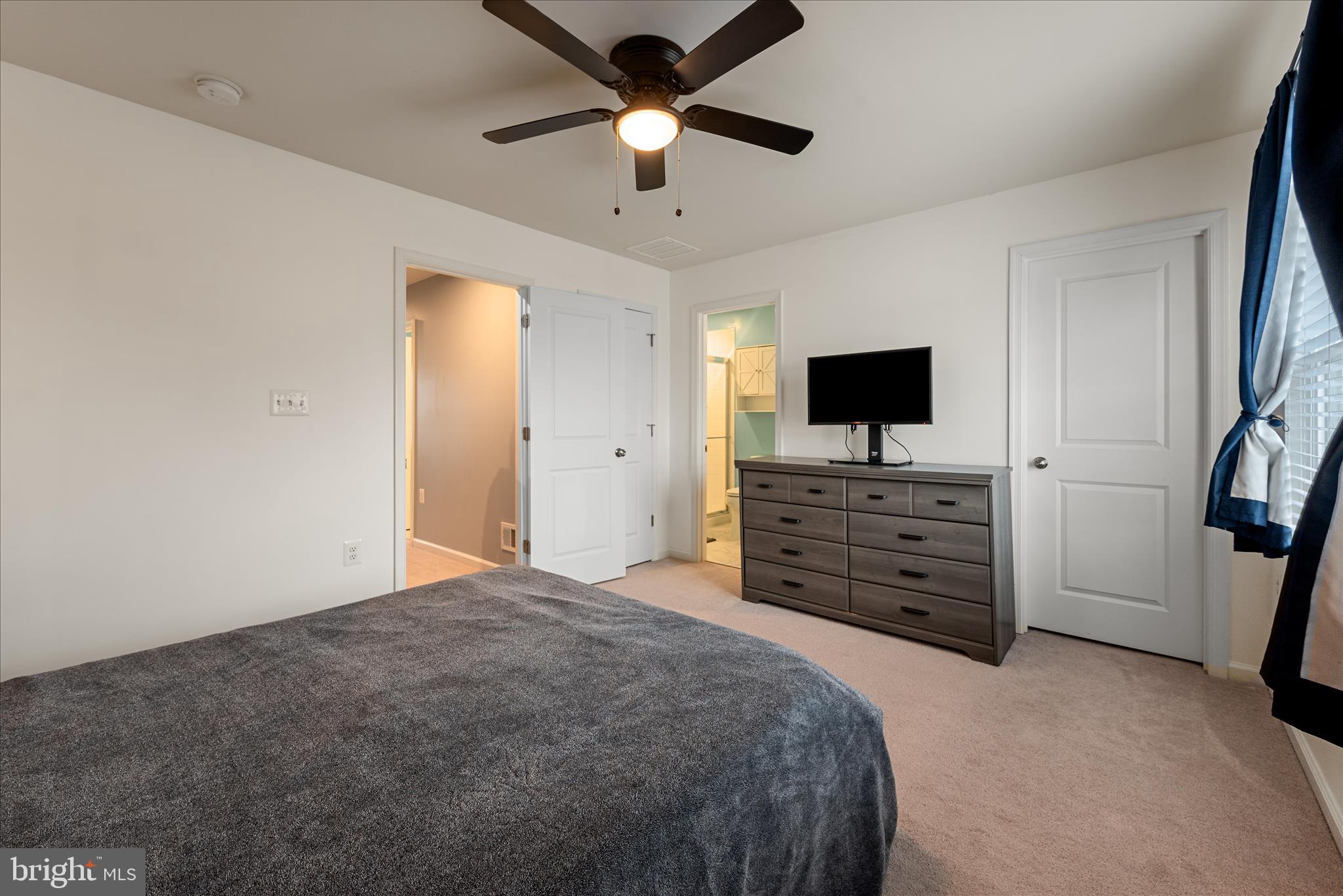 504 National Street Ranson, WV 25438 - Photo 19 of 33 a bedroom with a bed and a flat screen tv