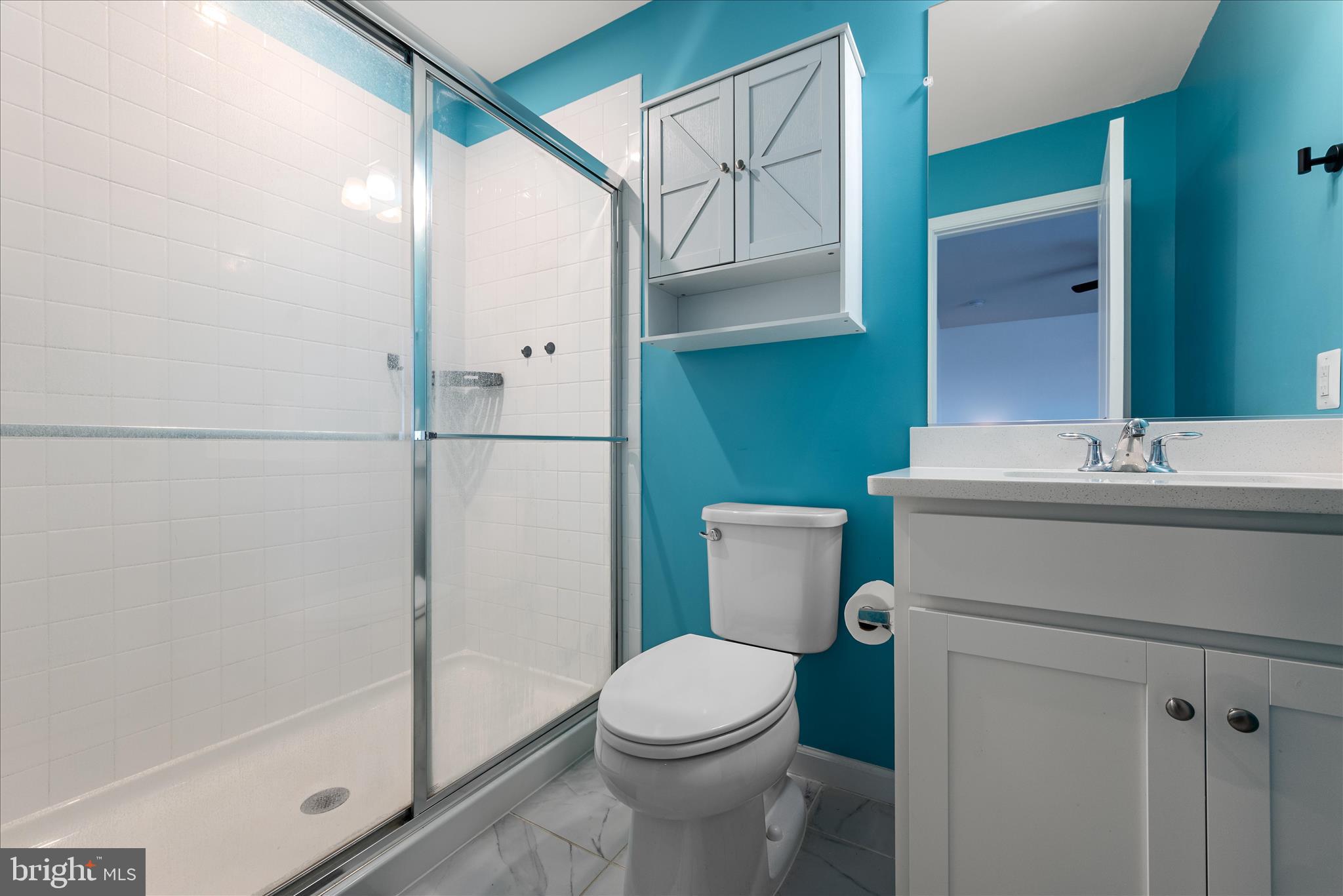 504 National Street Ranson, WV 25438 - Photo 20 of 33 a bathroom with a sink a toilet and shower